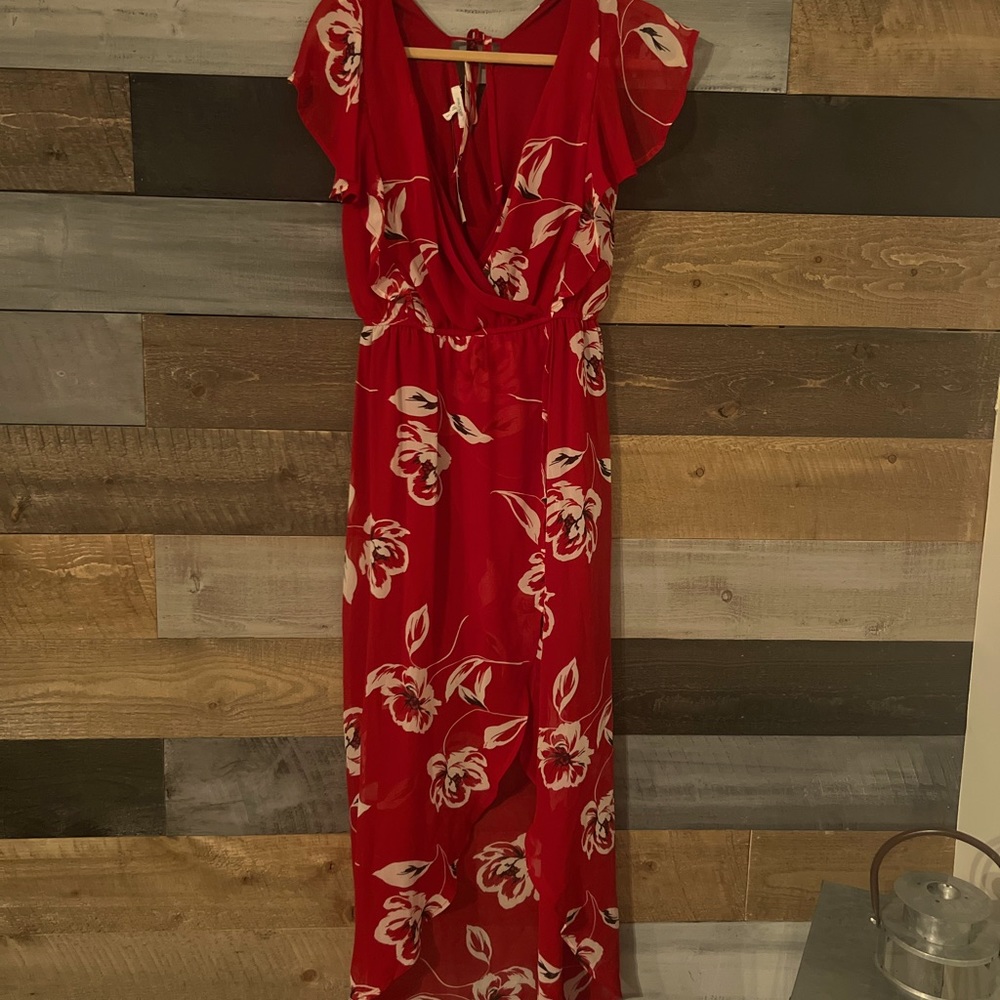 Beautiful red dress with flowers. Never been worn with tags.